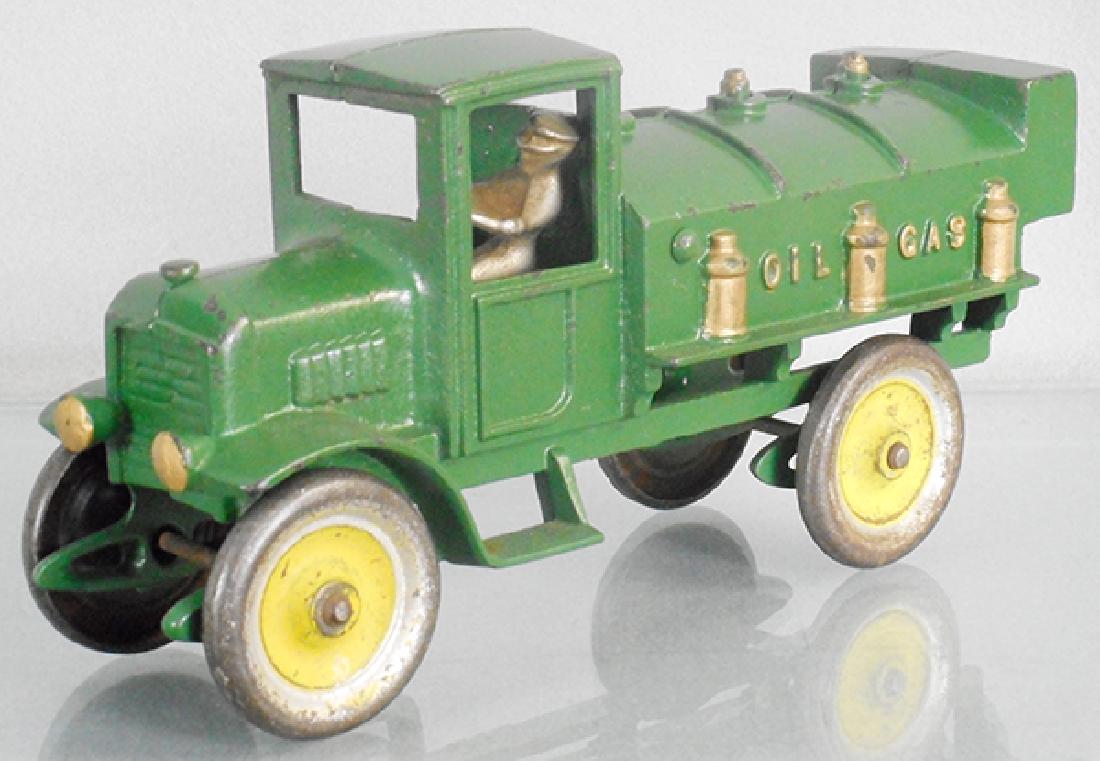 KENTON 556 TANK TRUCK: painted cast iron, 9 3/4 in long, green w/nickel driver, paint worn on wheels, C8.