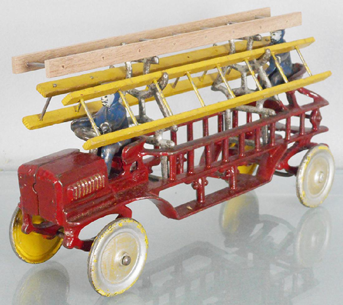 KENTON FIRE LADDER TRUCK: painted cast iron, 11 1/2 in long, wheels are repainted on front side, replacement ladders, C5-6.