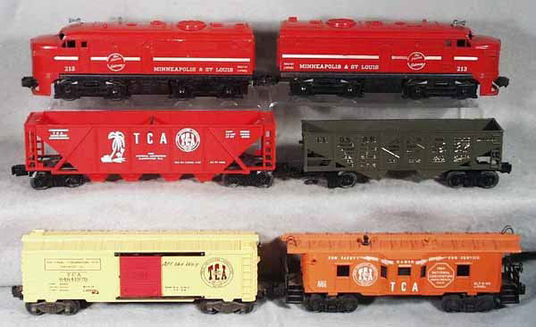 LIONEL TCA TRAIN SET: O ga, 213 M&StL Alco AA, both front coupler supports broken, 1967 TTOS hopper, 6436-1969 TCA hopper, 6464-1970 TCA box car, minor warp in roof, 6517-1966 TCA caboose, C5-8.