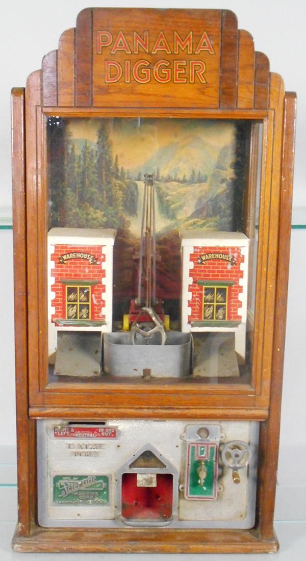 PANAMA DIGGER NOVELTY MACHINE: wood, die cast & glass, 36 in tall by 18 in wide by 16 in deep, by the Scientific Machine Co of Brooklyn, NY, coin operated, working, C7.