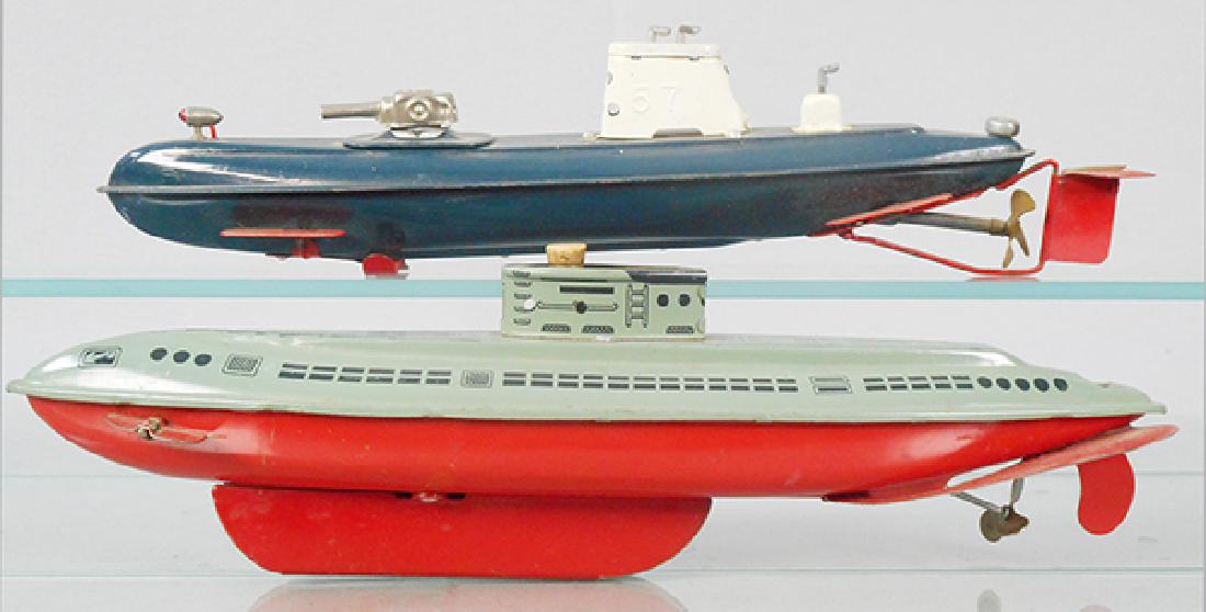 2 TOY SUBMARINES: litho tin, 13 in long, 1 is Japanese, battery operated, not tested, other is Wolverine, windup working, C6-8.