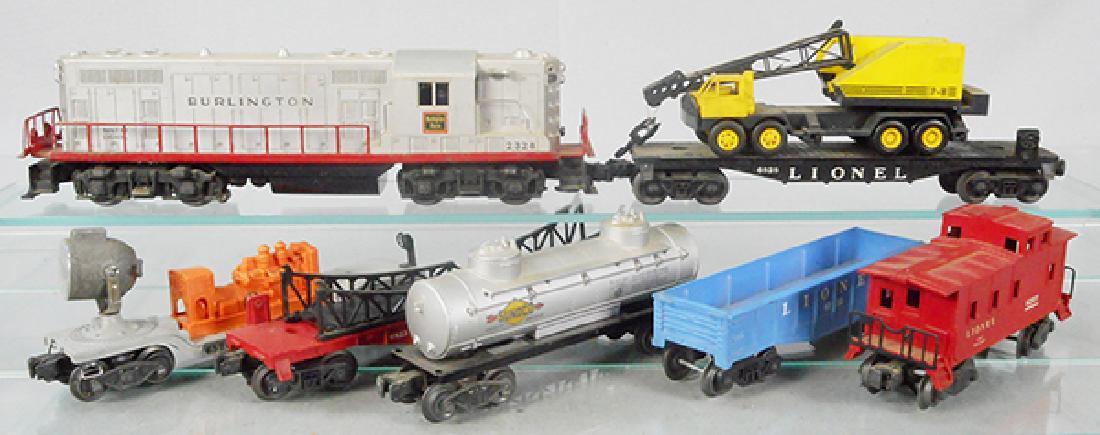 LIONEL TRAIN SET: O ga, 2328 Burlington GP7, oxidation on frame from battery, 6828 flat w/incom power shovel, 6520 searchlight generator, 6825 flat wcracked girder bridge, 6465 Sunoco tank, 6112 gondola, 6257 caboose,