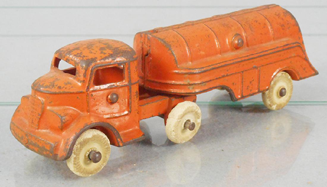 KENTON TANKER TRUCK: painted cast iron, orange, 7 in long, tires worn, C5.