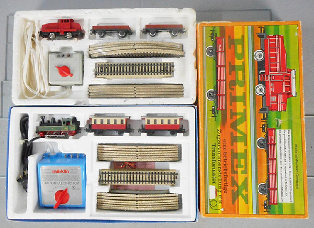 2 MARKLIN TRAIN SETS: HO ga, set 2092, plastic loco & 2 cars, w/track & transformer, orig set box worn & styrofoam base breaking apart, Primex set 2702, plastic loco & 2 gondolas, w/track & transformer, orig box some wear,