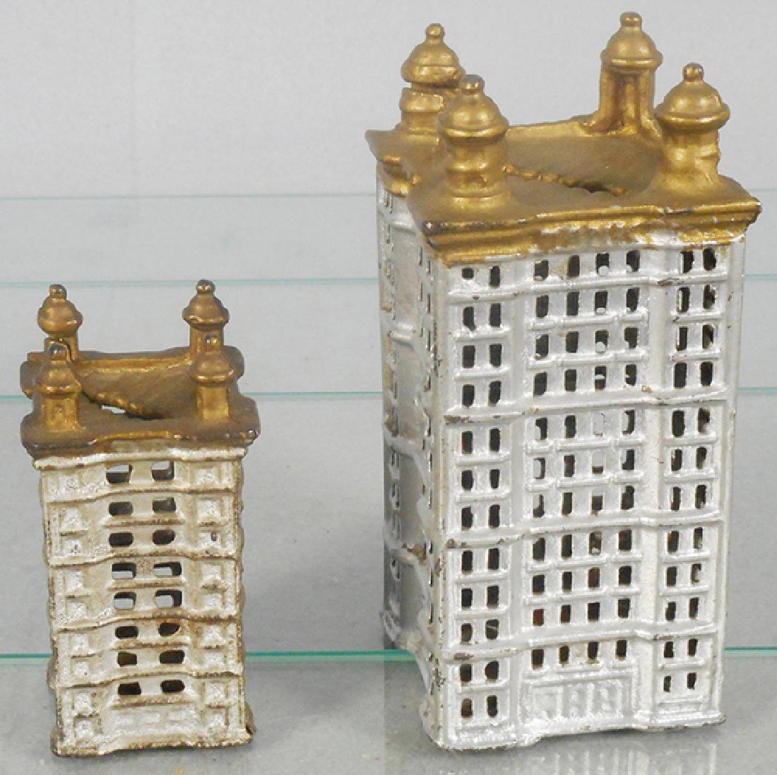 2 AC WILLIAMS SKYSCRAPER STILL BANKS: painted cast iron, 5 1/2 in tall & 3 1/2 in tall, C6-8.