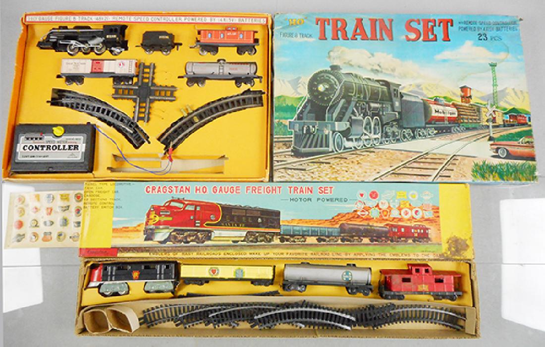 2 JAPANESE TRAIN SETS: HO ga, 2-rail, Bandai Freight set, litho tin, 24 in long, oxidation spots on caboose, battery operated, not tested, Alps Train set, litho tin, 23 in long, battery operated, not tested, missing some st