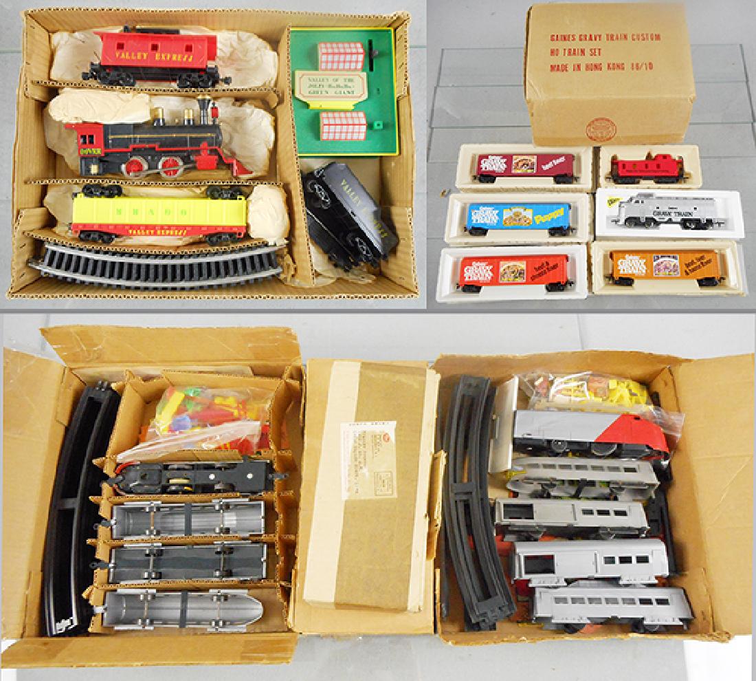 5 PROMOTIONAL TRAIN SETS: Japan, HO ga, Green Giant Valley Express, Marx, plastic, Gaines Gravy Train, plastic, w/track & transformer, 2 Sabo sets, battery operated floor trains, w/accessories, Post set, plastic, orig boxes wo