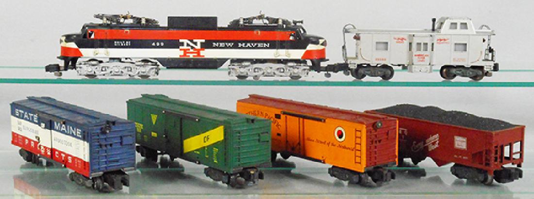 AMERICAN FLYER TRAIN SET: S ga, 499 New Haven EP5, 982 SOM box car, 922 GAEX box car, 947 NP box car, 921 CBQ hopper, 25052 action caboose, 1 roof corner cracked, C5-6.