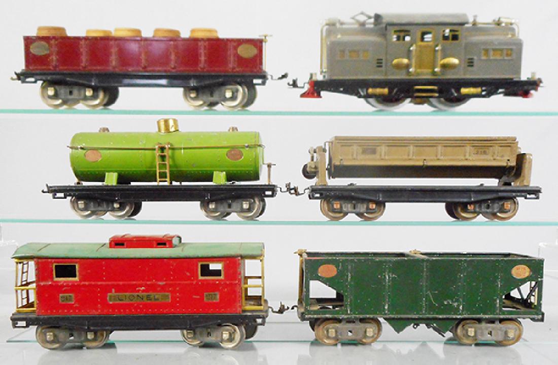 LIONEL TRAIN SET: std ga, 318 loco, rewheeled, 212 gondola w/5 split barrels, 215 tank, small dent on 1 side, 218 dump, painted ends, gear replaced, 216 hopper, missing 1 bottom door & 2 couplers broken, 217 caboose, C