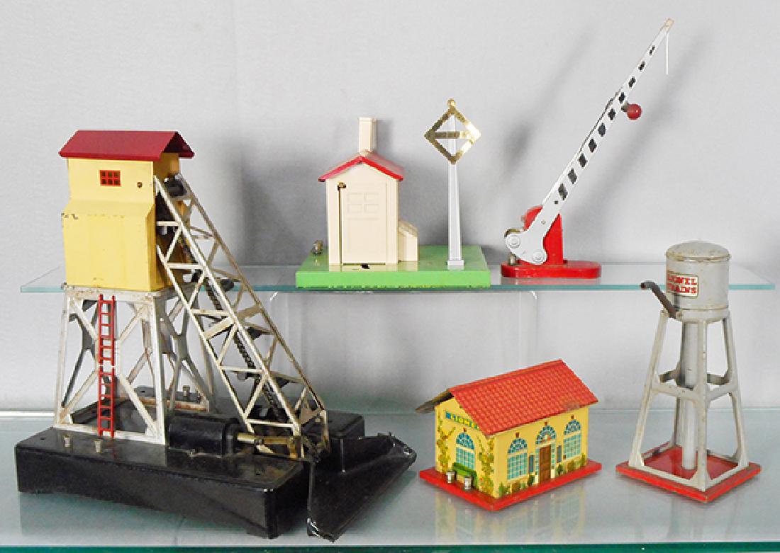 5 LIONEL ACCESSORIES: O ga, 97 coal elevator, scoop has chips, 45 watchman shack, oxidation spot on base, 152 crossing gate, 48W whistle station, 93 water tower, gray, C4-6.