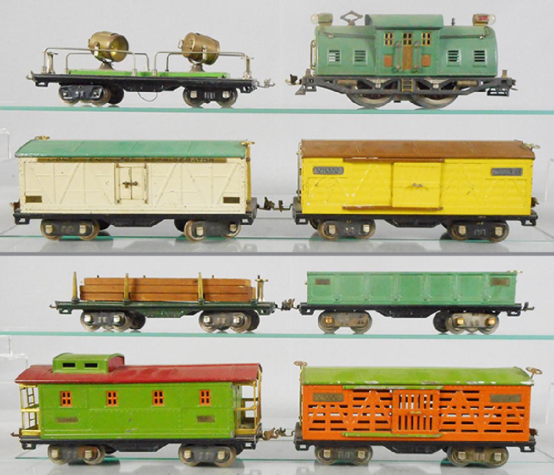 LIONEL TRAIN SET: std ga, 10E loco, rewheeled, missing 1 section of brass roof trim, 520 searchlight, restored chassis, 514R refrigerator, 514 box car, 511 lumber, 512 gondola, restored chassis, 513 cattle car, 517 cab
