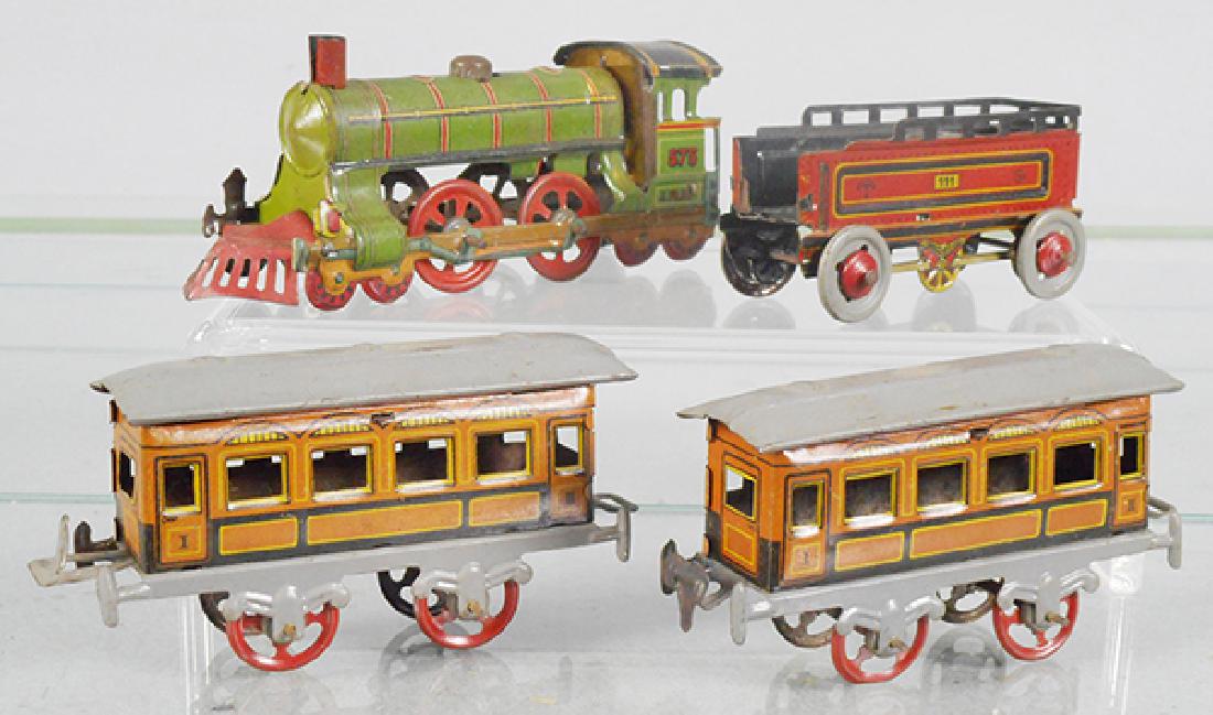 PENNY TOY TRAIN SET: litho tin, Meier 575 loco, 4 1/4 in long, CKO tender, 3 in long, 2 coaches, marked Made in Germany, 3 3/4 in long, C6-7.