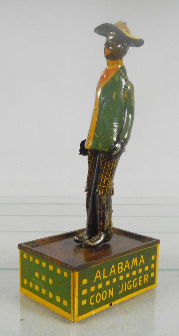 STRAUSS TOMBO ALABAMA COON JIGGER: litho tin windup, working, 10 1/2 in tall, C5-6.