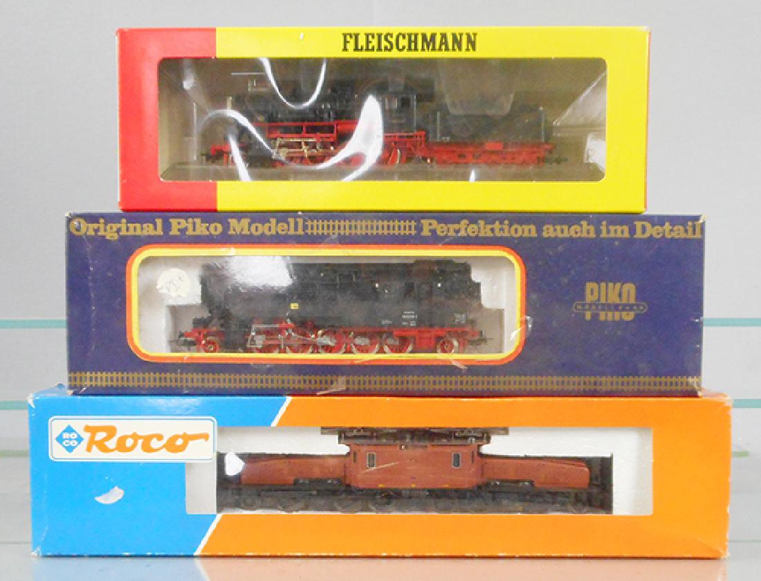 EUROPEAN TRAIN LOT: HO ga, Fleischmann 1156 loco & tender, Piko tank loco, Roco 43941 Crocodile, brown, orig boxes, 2 have some wear, C8-9.