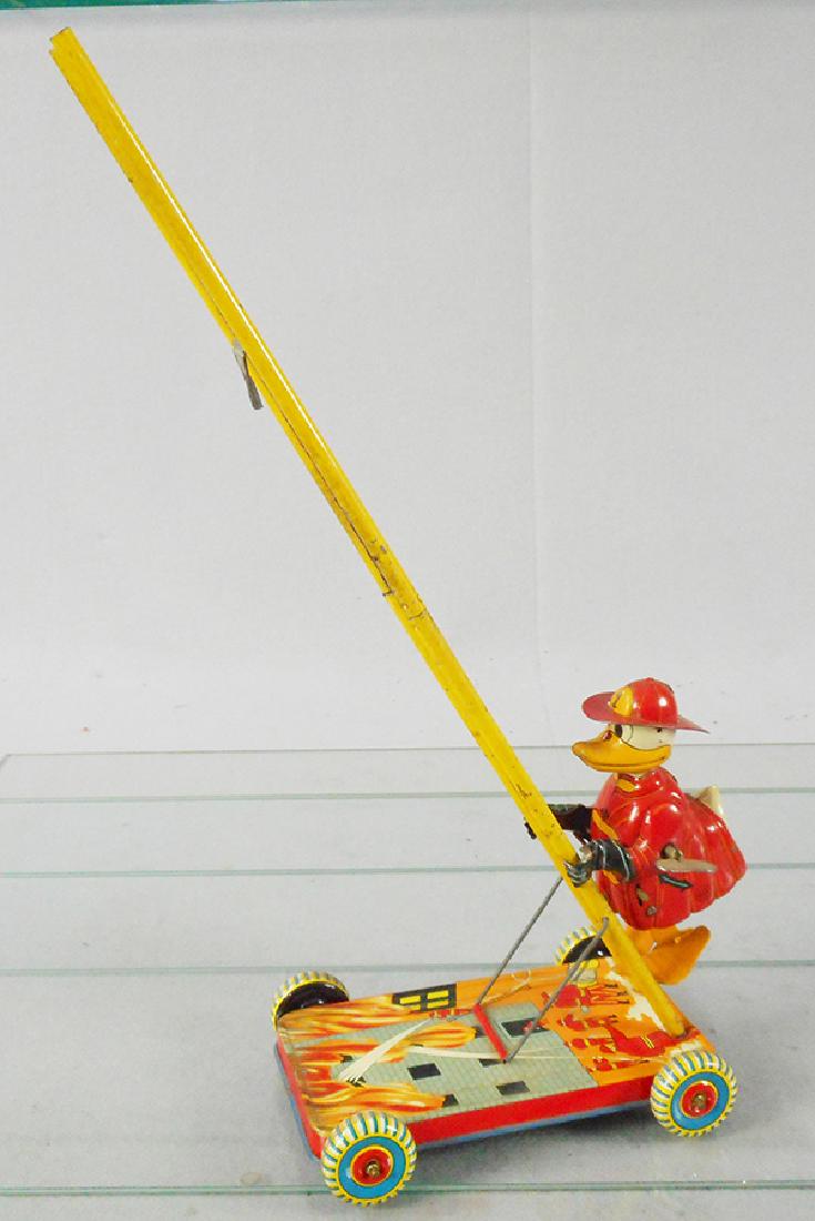 MARX DONALD DUCK CLIMBING FIREMAN: litho tin, windup working, 16 in tall, C5-6.