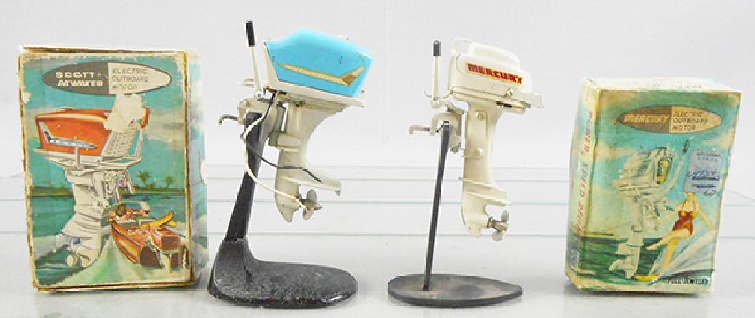 2 FLEET LINE OUT BOARD MOTORS: Japan, metal, batt ops, not tested, 36 Scott-Atwater, 4 in tall, 45 Mercury, 4 in tall, both have playwear, orig boxes rough, C5.