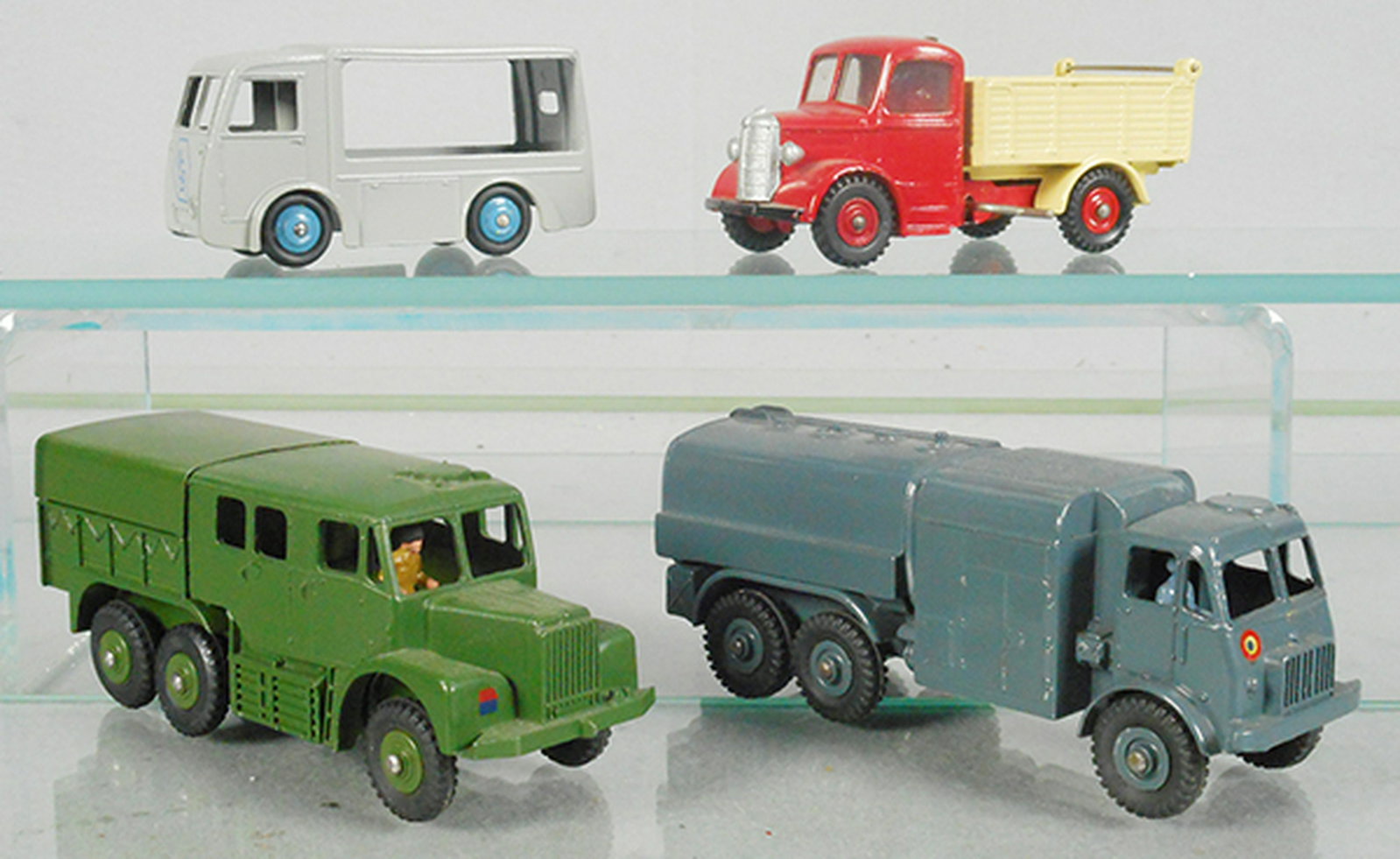 4 DINKY VEHICLES: 30V NCB Electric Van, 410 Bedford Dump Truck, oxidation behind cab on bed, 689 Medium Artillery Tractor, 642 Pressure Refueller, C7-9.