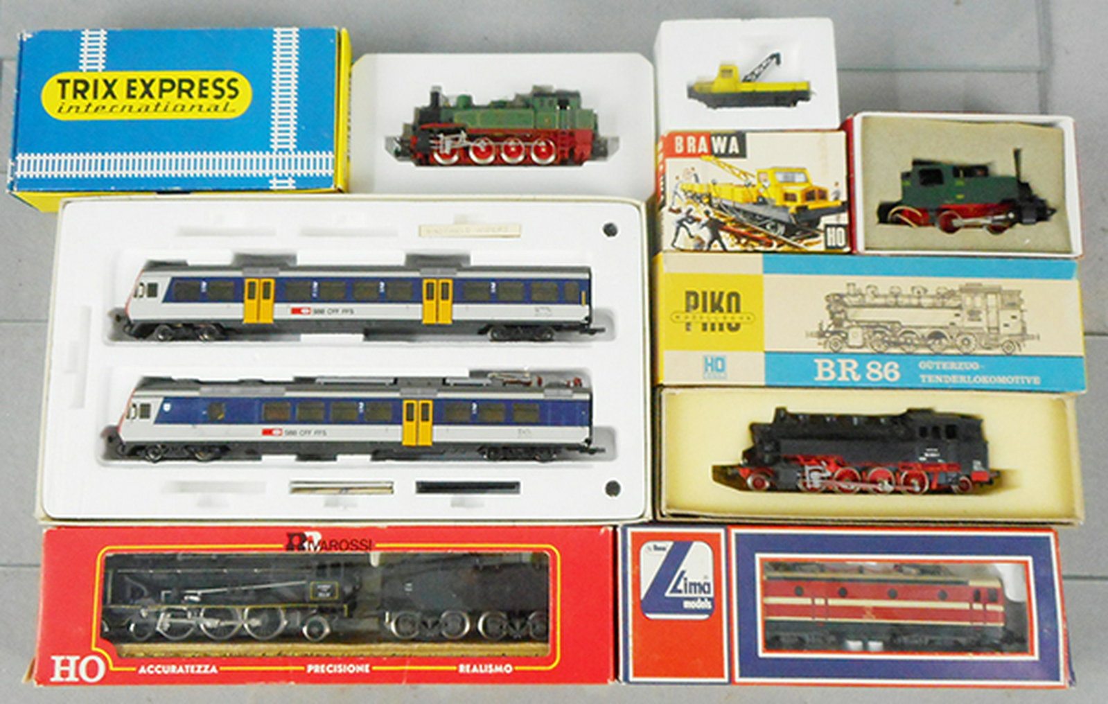 7 EUROPEAN LOCOS: HO ga, 2-rail, Trix 2428 tank loco, Liliput 14451 Swiss Interurban, Rivarossi 1341 Pacific loco, Brawa 458 Crane Car, Rivarossi 1151 tank loco, Piko 17027 tank loco, Lima 20 806L electric loco, orig b