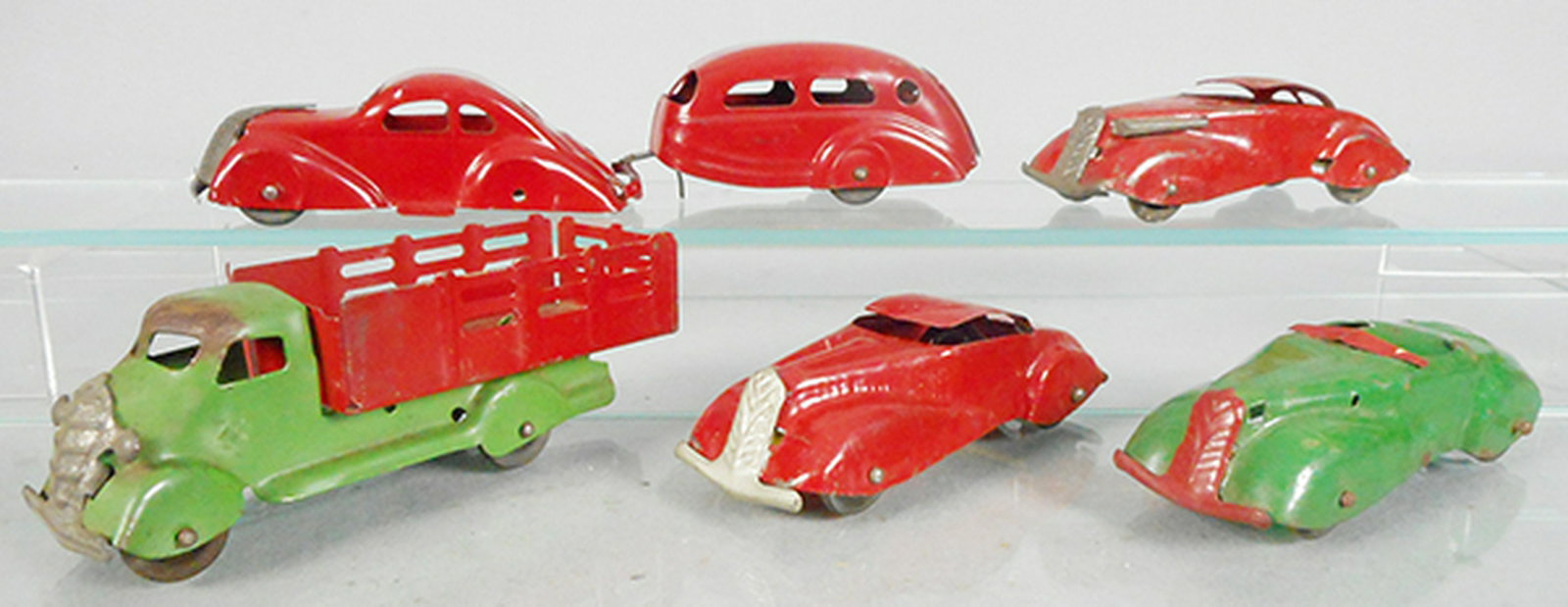WYANDOTTE & MARX VEHICLES: painted pressed steel, Wyandotte Sedan & Trailer, 11 in long, Stake Truck, 7 in long, oxidation on cab, Marx 2 Coupes, each 6 in long, Convertible, missing lights & driver, some oxidation spots, 6 in 