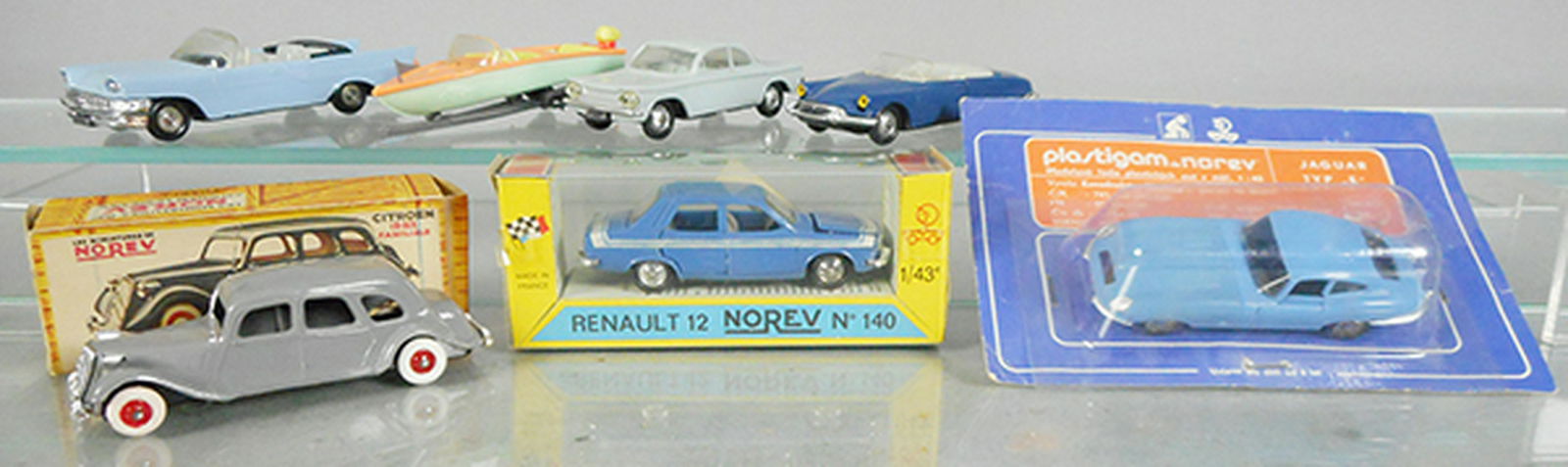 6 NOREV PLASTIC VEHICLES: 92 Chrysler New Yorker & Boat Trailer, hitch cleanly cracked, minor warp to boat, 69 Corvair, 88 Citroen DS19 Cabriolet, 3 Citroen 15-Six, 140 Renault 12, 156 Jaguar on Polish issue card, C6-10.