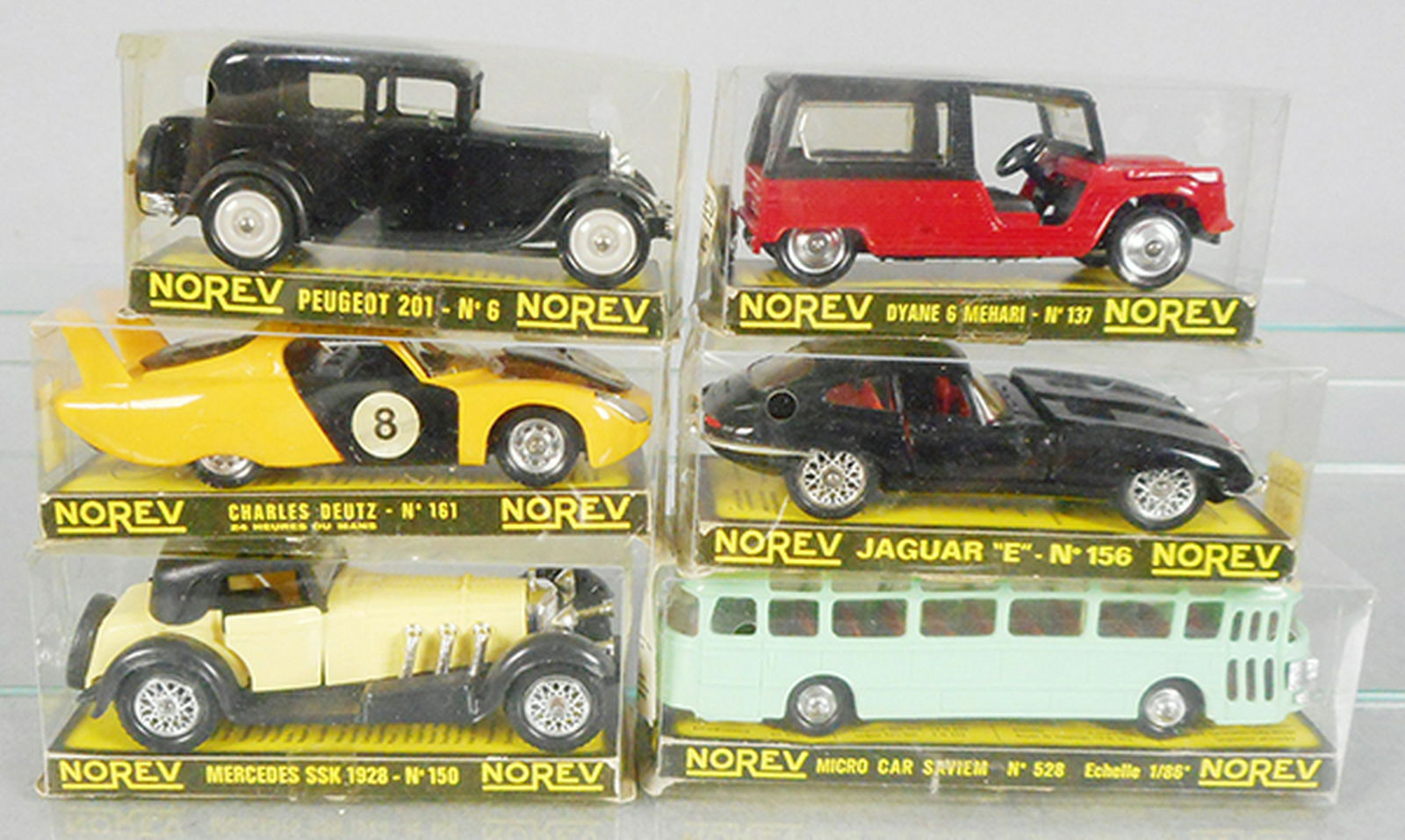 6 NOREV PLASTIC AUTOS: 6 Peugeot 201, 161 Charles Deutz, 150 Mercedes 55K, 137 Dyane 6 Mehari, 156 Jaguar XKE, 528 Saviem Motor Coach, orig boxes minor wear, C8-9.