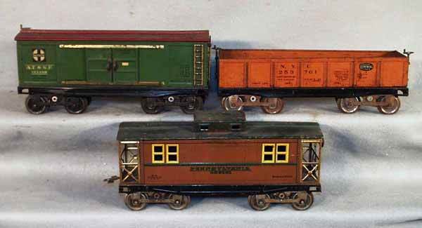 DORFAN CARS: std ga, SF box car, missing 1 brakewheel top; NYC gondola; PA caboose, roof repainted green, cars on Lionel trucks, some rust, missing 5 couplers, C3.