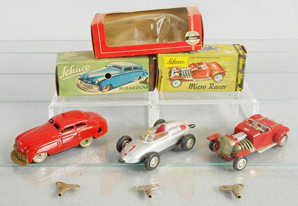 3 SCHUCO VEHICLES: 1001 Mirako Car, 4 1/2 in, 1037 Porsche F2 Micro Racer, 4 in, 1036 Hot Rod Micro Racer, 4 in, all are windup working, orig boxes worn, C7-8.