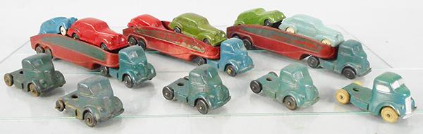AUBURN RUBBER GMC CARRY CAR SETS: 3 #AT13 w/5 extra tractors, 6 #AA02, missing 1 wheel, all have warping, some have cracks & chips, C4-6.