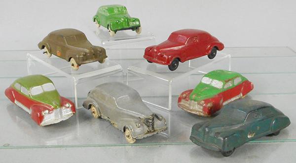7 AUBURN RUBBER AUTOS: AA03, 3 #AA04, 3 #AA05, 1 missing a wheel, all have a body warp, C4-6.