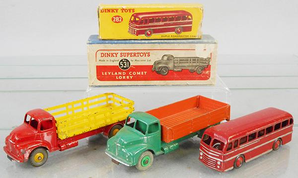 3 DINKY VEHICLES: 532 Comet Wagon, green & orange, 531 Comet Stake Truck, red & yellow, 282 Duple Bus, red, 2 orig boxes only, boxes worn, C4-5.