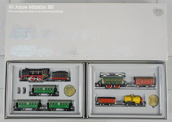 MARKLIN 0050 50 YEARS OF HO DOUBLE SET: HO ga, passenger & freight sets, complete w/poster, orig boxes, inserts & orig set box minor wear, inserts yellowed, C9-10.