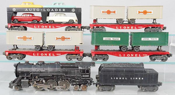 LIONEL TRAIN SET: O ga, 2035 loco, w/reproduction boiler front, 6466W tender, 2 #6430 trailer flats, 1 has worn trailers, melt marks around die cast landing gear, 3460 trailer flat, 6414 autoloader, C5-6.