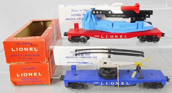 2 LIONEL SPACE CARS: O ga, 6650 missile launching flat car, missile worn, 3419 operating helicopter car, 1 broken tail propeller, w/instruction sheets, orig boxes minor wear, C7-8.
