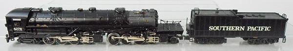 LIONEL 11107 SOUTHERN PACIFIC CAB FORWARD LOCO & TENDER: O ga, loco is play worn with paint chips, glue residue on boiler side, platform handrails are broken & bent, some trim missing, w/tender, orig box & insert minor wear, C6.
