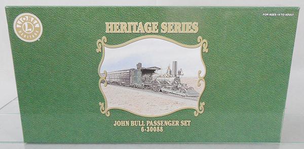 LIONEL 30088 JOHN BULL TRAIN SET: O ga, loco, tender, 2 coaches, set is playworn, loco has bent trim, tender light housing is cracked, both coaches have broken brakeshoes, orig box & insert, C7.