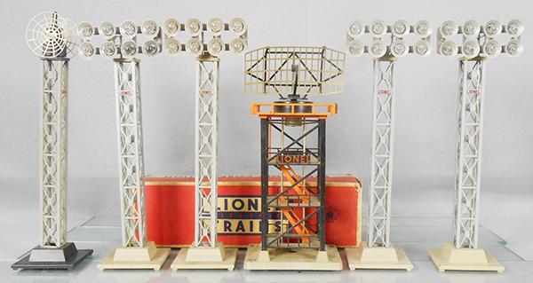 LIONEL ACCESSORIES: O ga, 199 microwave tower, w/split antenna, 4 #195 RR Yard floodlights, 1 orig box, repaired, 197 radar tower, missing 1 long tower support, C5-7.