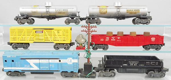 6 LIONEL FREIGHT CARS: O ga, 2 #6555 Sunoco tank, 6656 Armour stock car, 6462 gondola w/barrels, 3530 generator car, 3469 dump car, orig boxes rough, C5-7.