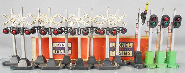LIONEL ACCESSORIES: O ga, 9 #154 crossing signals, 1 orig box only, 151 semaphore, orig box, 3 #153 block signals, some have layout paint on bases, C5-7.