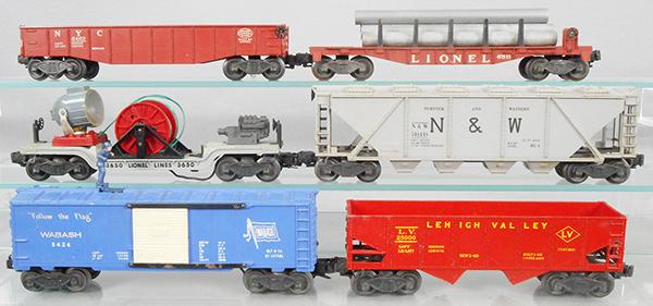 6 LIONEL FREIGHT CARS: O ga, 6462 gondola, 6511 pipe car, 3650 searchlight car, 6446 hopper, 3424 brakemans car w/accessories, 6456-75 hopper car, orig boxes rough, C5-7.