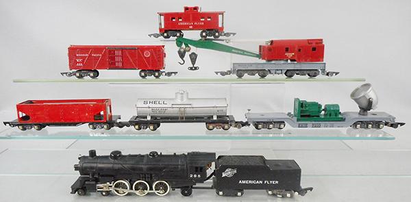 AMERICAN FLYER TRAIN SET: S ga, 285 Pacific loco & tender, w/smoke & choo choo, 716 hopper, missing decals, 625 Shell tank, 946 searchlight, missing 1 brakewheel, 629 cattle, missing door latches, 644 crane, 638 caboose, C5-7.