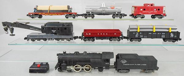 AMERICAN FLYER TRAIN SET: S ga, 303 Atlantic loco & tender w/smoke & choo choo, 946 crane, 919 CB&Q dump car, 911 pipe gondola, 1 support cracked, 971 lumber car w/button, 925 Gulf tank, 934 caboose, C5-7.