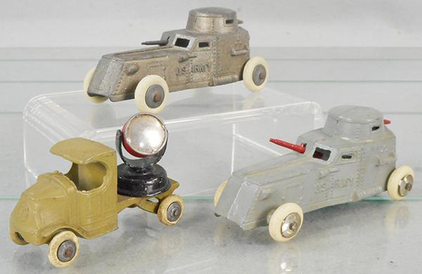 3 TOOTSIETOY MILITARY VEHICLES: 2 #4635 armored cars, 1 bronze w/worn paint, other gray, 4644 Mack searchlight truck, khaki, C5-7.