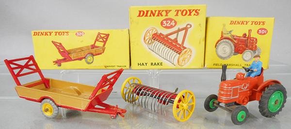 3 DINKY FARM TOYS: 301 Field Marshall tractor, orange, 324 hay rake, 320 harvest trailer, orig boxes minor wear, C8.