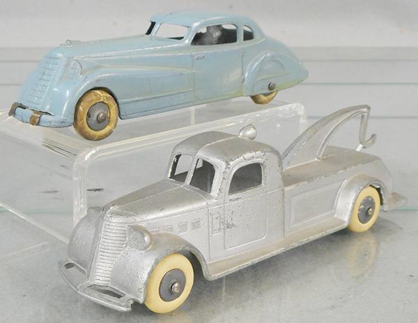 2 TOOTSIETOY JUMBOS: 1017 Coupe w/chassis, blue, tires worn, 1027 Wrecker, silver, C6-8.