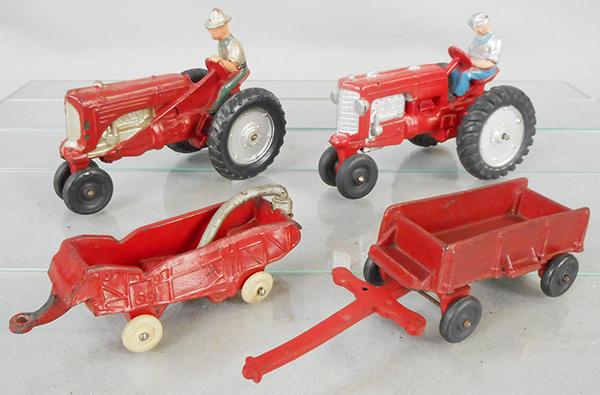 4 AUBURN RUBBER FARM TOYS: AF03 Tractor, 8 in long, AF04 Tractor, 7 3/8 in long, AI03 Thresher, 5 1/2 in long, warped but complete, Wagon, 9 in long, C6-8.