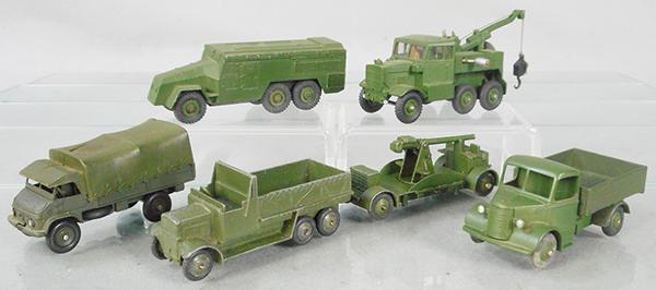 6 DINKY MILITARY VEHICLES: green, 677 Armoured Command Car, 661 Recovery Tractor, 821 Mercedes Unimog, plastic cover cracked, 1516 Covered Wagon, 161 AA Gun, tow hook bent, 25WM Bedford Truck, C5-7.