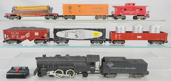 AMERICAN FLYER TRAIN SET: S ga, 303 Atlantic loco & tender w/smoke & choo choo, 921 CB&Q hopper, 1 step broken, 981 Central of Georgia box car, 941 Frisco gondola w/containers, 971 Moe & Joe lumber car w/button, 802 IC box car