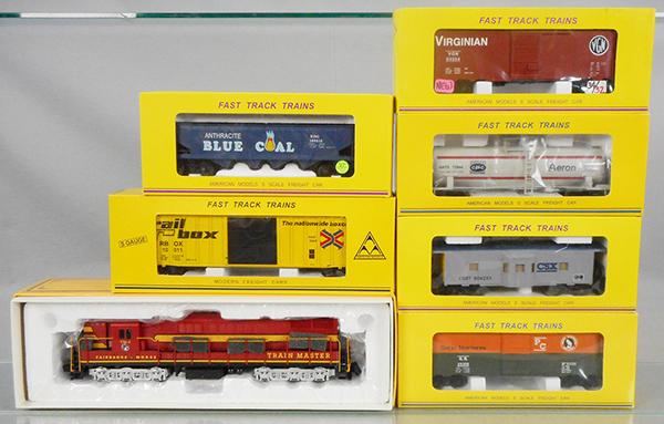 AMERICAN MODELS TRAIN SET: S ga, Trainmaster Demonstrator TM-4 Fairbanks Morse loco w/Hi-Rail, 3414 hopper, 1143 box car, 514-44 tank, 1108 box car, 5001 box car, 7724 caboose, orig boxes & inserts, C8-9.