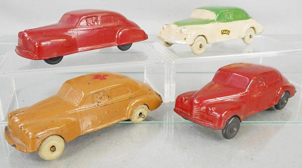 4 AUBURN RUBBER OLDSMOBILE: 4 #AA04 1940 Oldsmobiles, 6 in long, red w/closed fenders, Taxi, Military, red w/open fenders, C5-7.