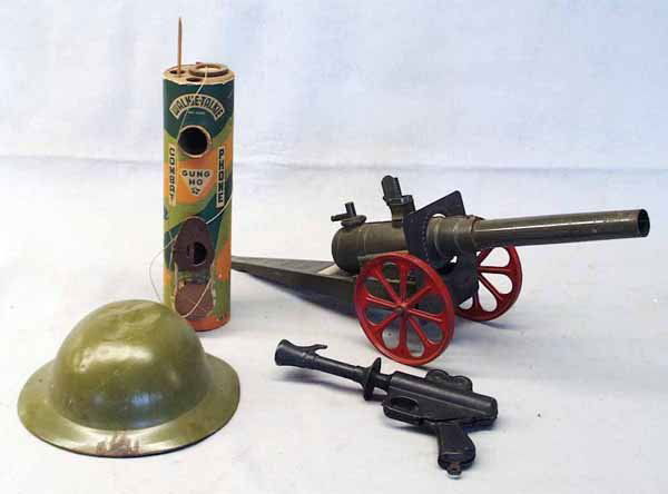 4 ARMY TOYS: Doughboy Helmet, pressed steel, dented; Walkie Talkie, litho paper on wood, antenna broken; Big Bang Cannon, 24 in long; Daisy Buck Rogers Disintegrator Toy, painted pressed steel, not working, repain